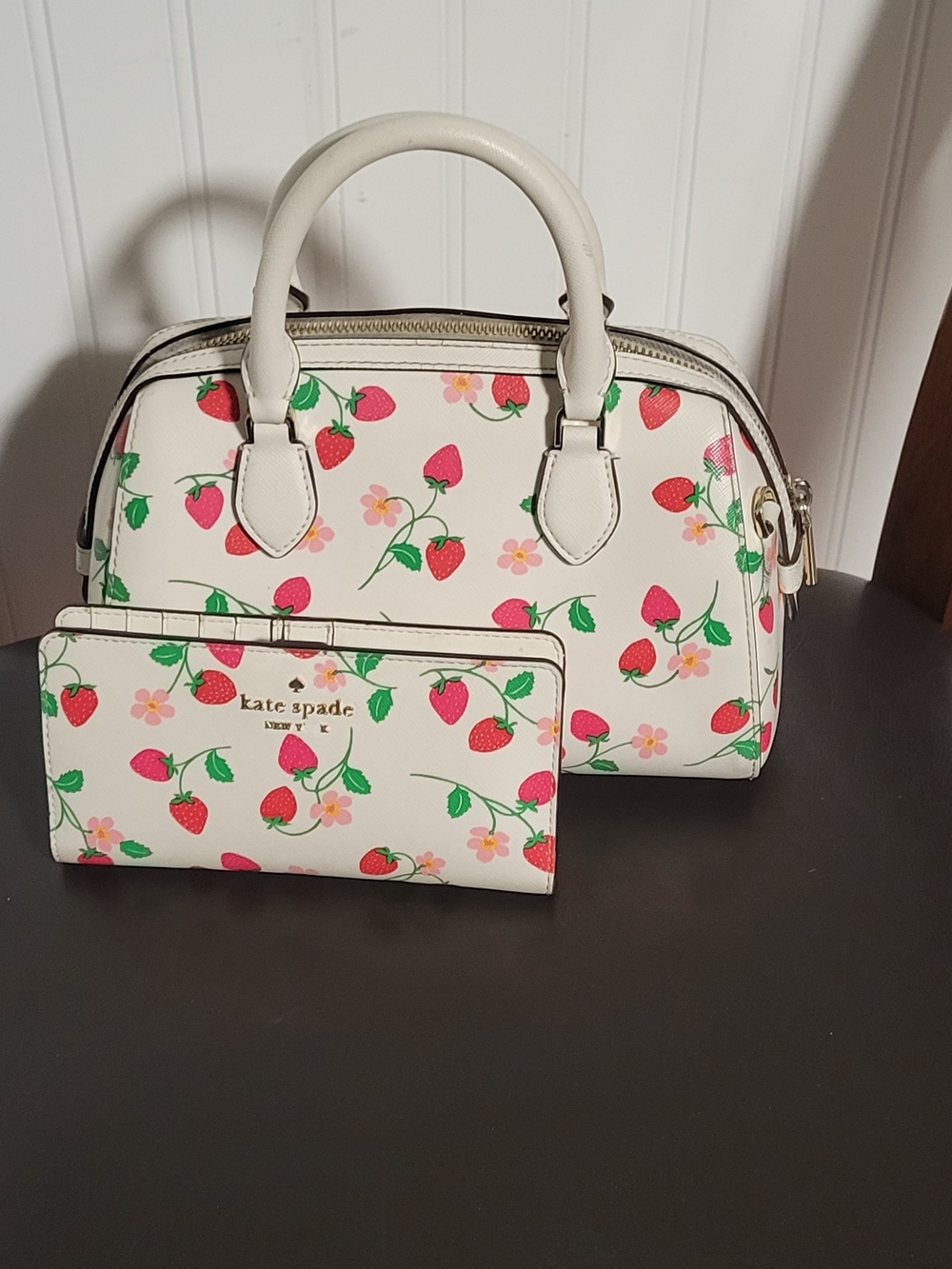 Coach Strawberry Purse and Wallet with a matching hat.